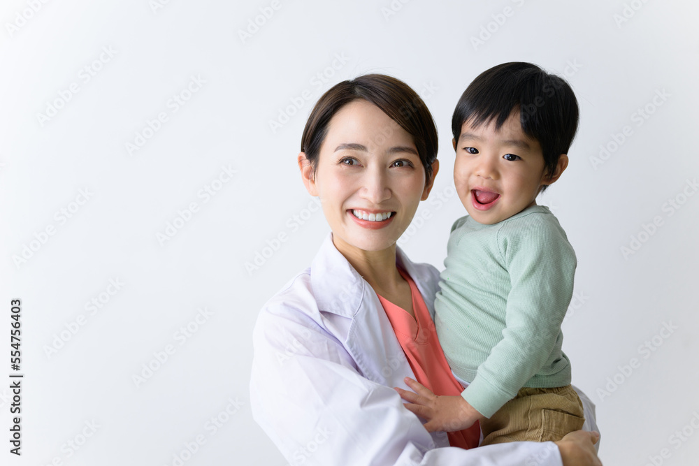 Image of a female doctor working while raising a child Image of a female doctor working while raising a child