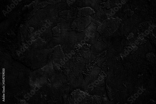 Dark black concrete wall background with rough texture. grunge black cement background