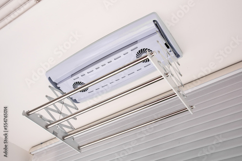 Clothes drying rack installed on the ceiling