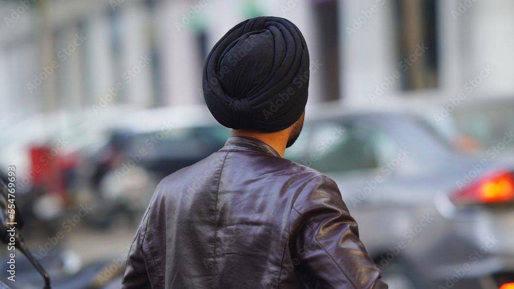 Young Punjabi man watching parking for car Young Punjabi man watching parking for car