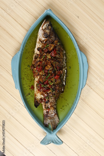 Baked whole lapu lapu fish, a dish from the Philippines photo