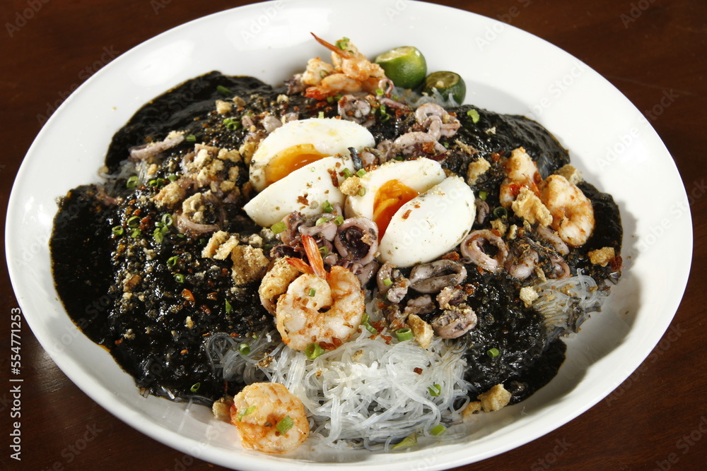 Squid ink palabok, a variation of a noodle dish from the Philippines Squid ink palabok, a variation of a noodle dish from the Philippines