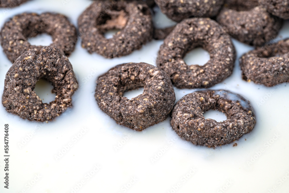 Chocolate flakes in milk in the form of rings close-up