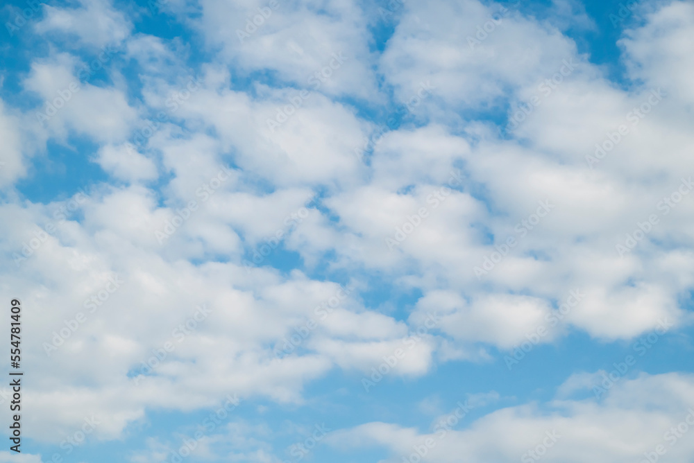 Natural background of blue sky, fluffy clouds, and cloudscape in the daytime. Natural background of blue sky, fluffy clouds, and cloudscape in the daytime.