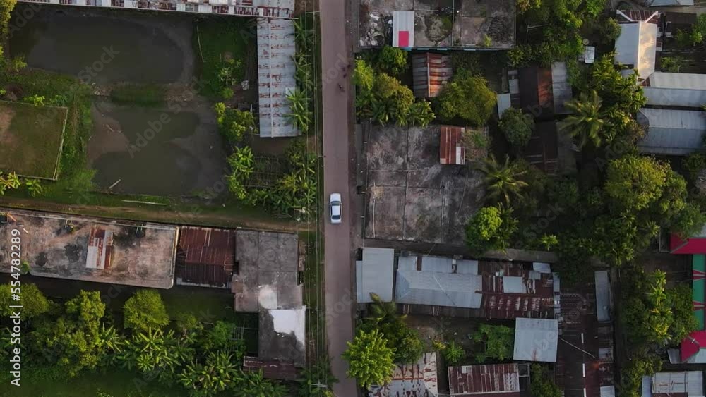 Bird Eye view Establishing shot of Slums. Car driving. Passing by. Bird Eye view Establishing shot of Slums. Car driving. Passing by.