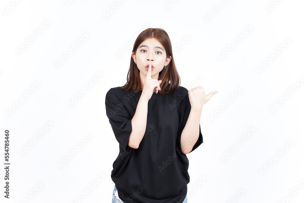 Shh gesture, Presenting and Pointing Side Product Using Thumb Of Beautiful Asian Woman Shh gesture, Presenting and Pointing Side Product Using Thumb Of Beautiful Asian Woman