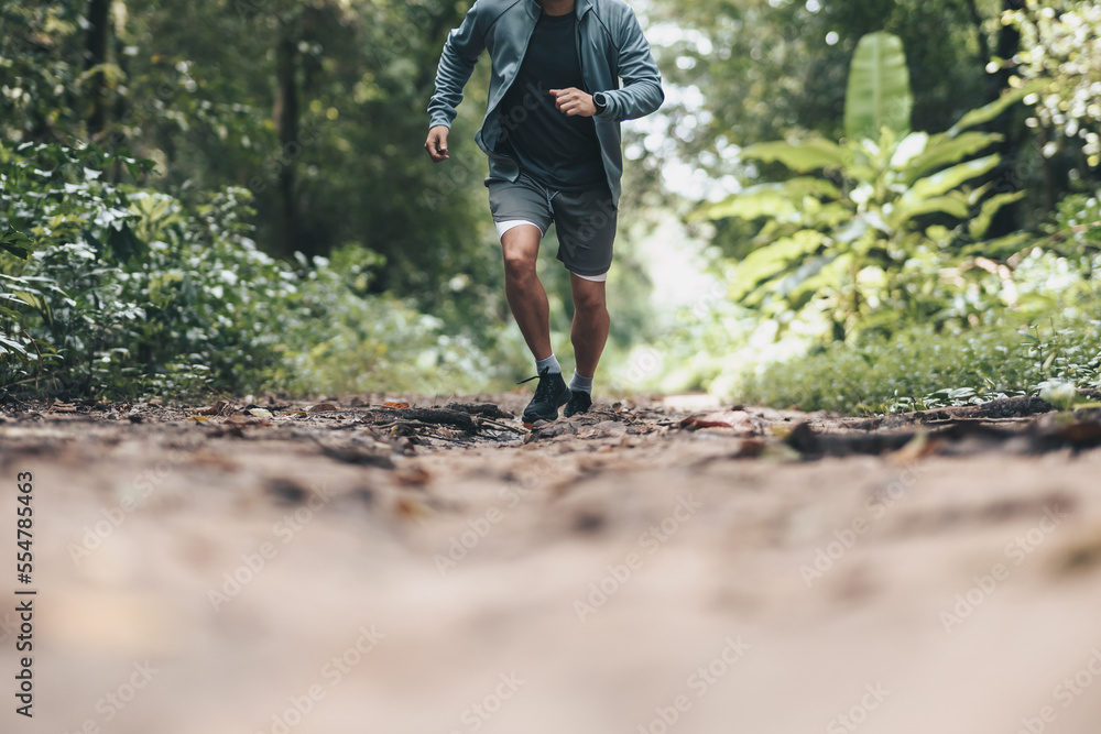 healthy lifestyle young fitness man running the forest. Outdoor workout, Healthy lifestyle concept. healthy lifestyle young fitness man running the forest. Outdoor workout, Healthy lifestyle concept.