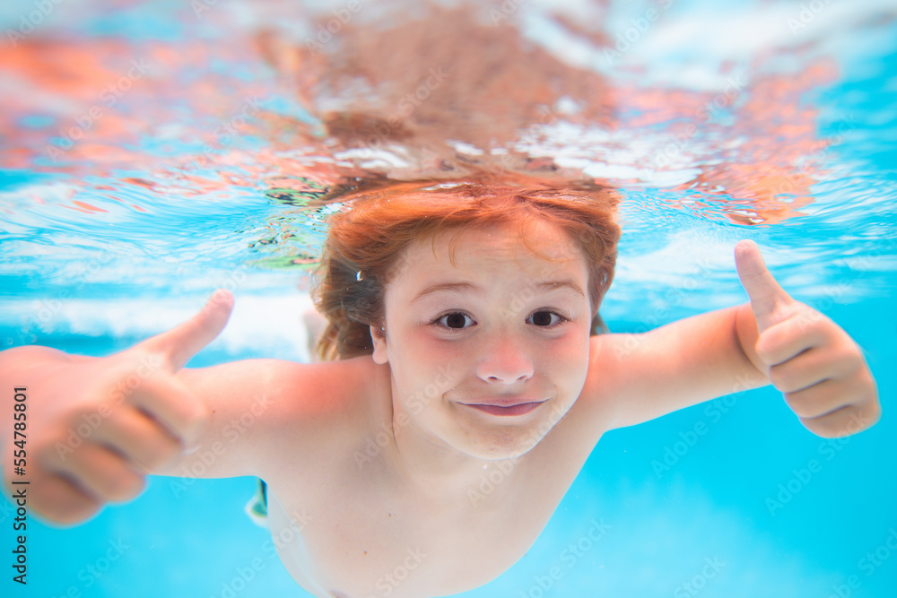 child-face-underwater-with-thumbs-up-kid-swimming-in-pool-underwater