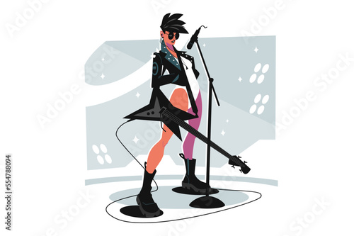 Female rock musician playing electric guitar