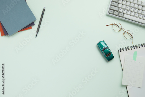 office supplies on the modern green desk. top view and copy space