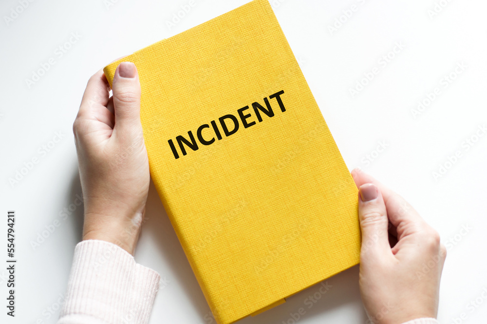 Businessman holding notebook with text incident. financial market. financing Businessman holding notebook with text incident. financial market. financing