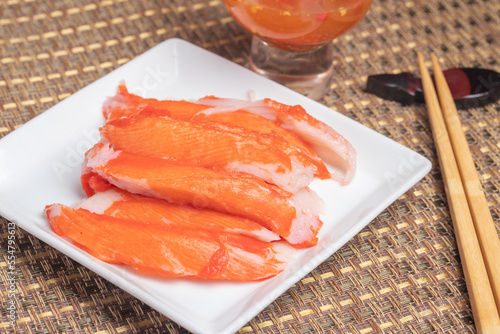 Boiled crab sticks with spicy and sour sauce