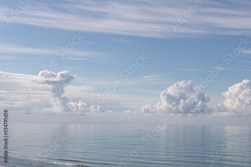Blue sky with clouds over the sea 