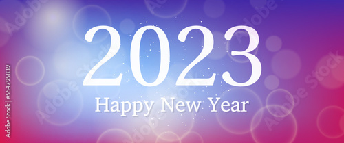 Happy new year 2023 incription on blurred background