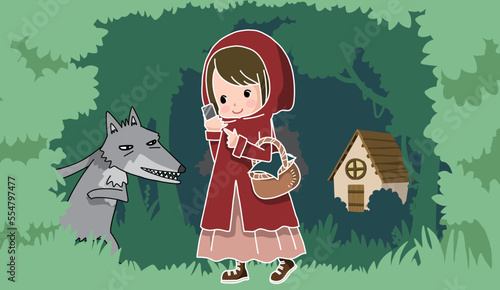 森の中をスマホを見ながら歩く赤ずきんみたいな女の子