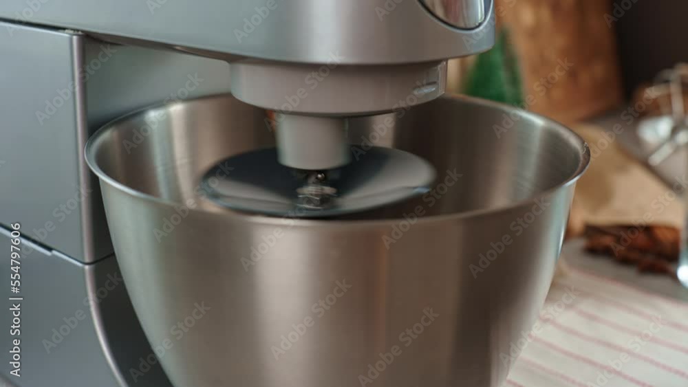 Preparation of dough in an electric mixer at home. Professional mixer for kneading dough. Modern appliances in the kitchen Preparation of dough in an electric mixer at home. Professional mixer for kneading dough. Modern appliances in the kitchen