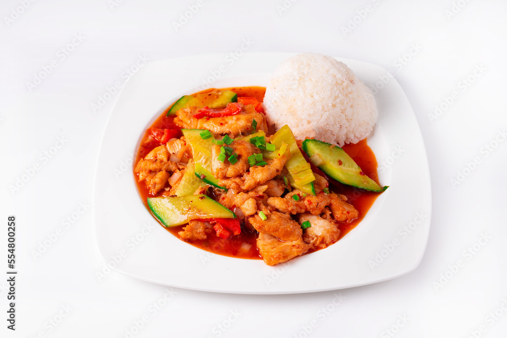 chicken meat with vegetables and rice on a white background chicken meat with vegetables and rice on a white background