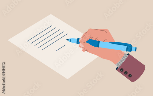 Male hand holding a pen and writes on sheet of paper Fototapet