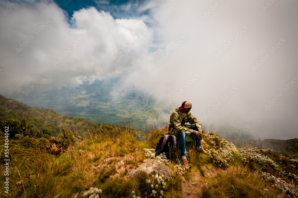 Taking a break climbing up Muhabura Volcano, Rwanda