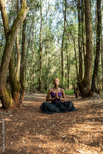 lotus pose in the woods