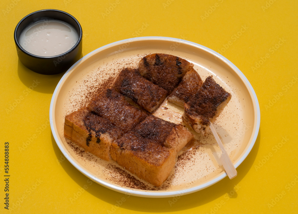 Toast topped with sweetened condensed milk and chocolate. Toast topped with sweetened condensed milk and chocolate.