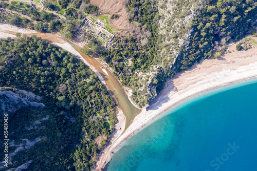 Fototapeta Naklejka Na Ścianę i Meble -  Aerial top view of Olympos beach and remains of Ancient City on sunny winter day. Turkey.