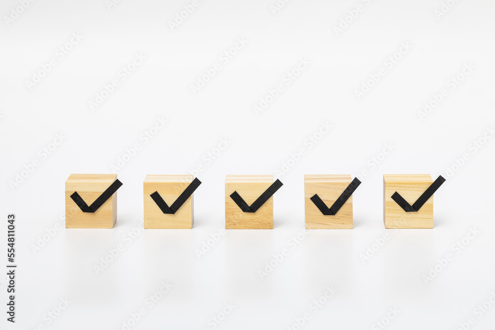 wooden block with check mark on white background wooden block with check mark on white background