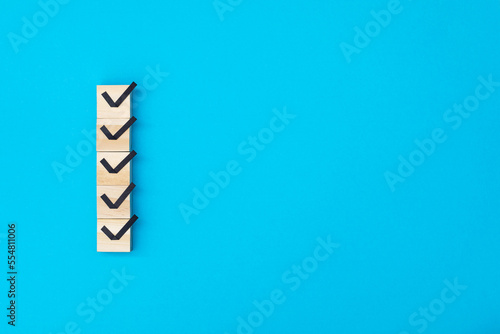 Checklist concept  Check mark on wooden blocks