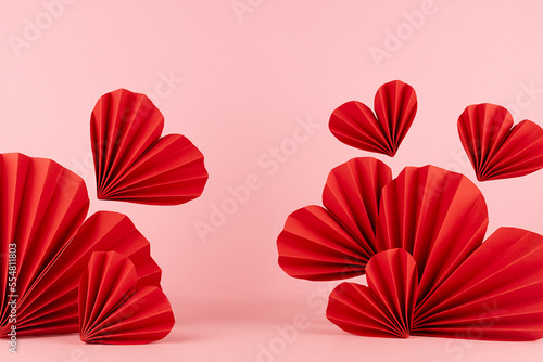 Hot love Valentines day stage mockup - red ribbed paper hearts fly on light pink backdrop  frame  copy space. Romance template scene for advertising  presentation  design  card  poster  flyer.
