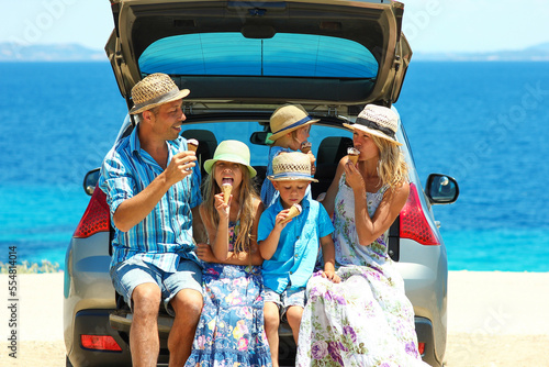 family near the sea by car