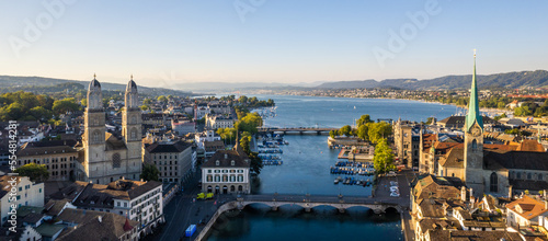 Aerial drone shot flying above Lake Zurich, Switzerland in sunny day.