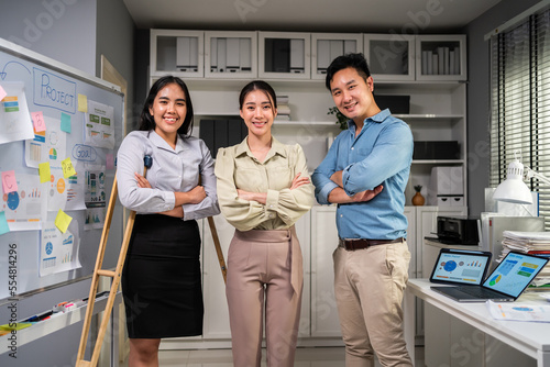 Portrait of Group of Asian young businessman and woman work in office.  photo