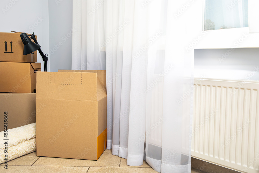 Fototapeta premium Concept of move in modern flat with boxes