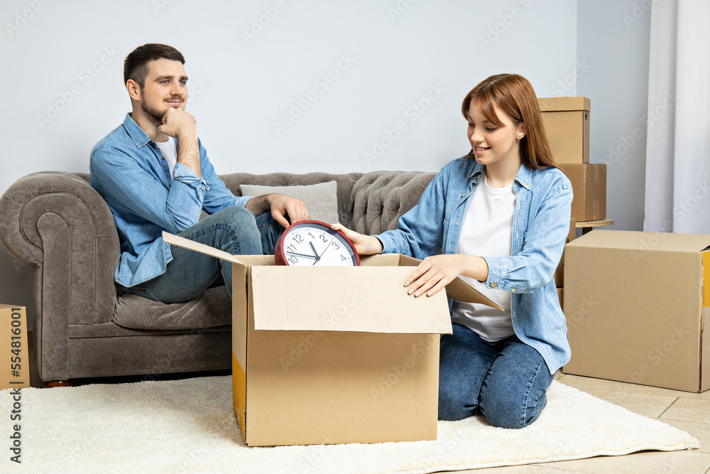 Concept of move with a happy young couple Concept of move with a happy young couple