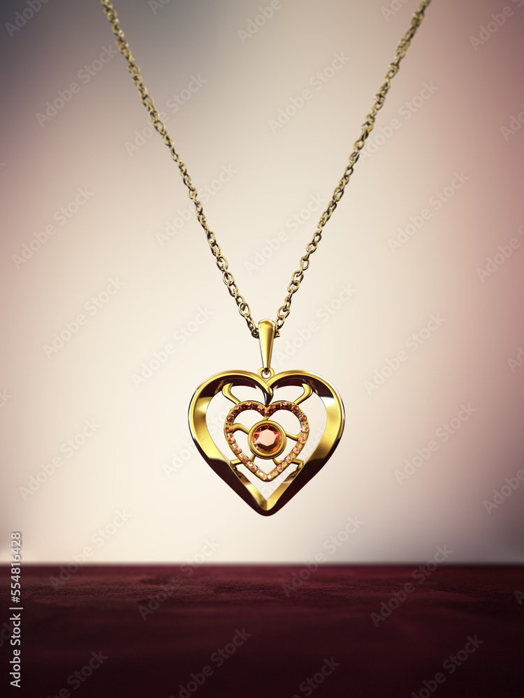 Gold heart necklace decorated with ruby gemstones