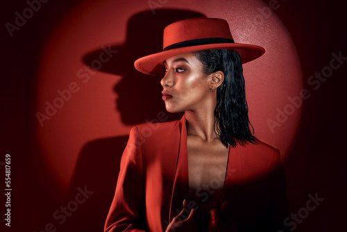 Bilde på lerret Fashion, spotlight and woman in red suit, vintage clothing or retro outfit
