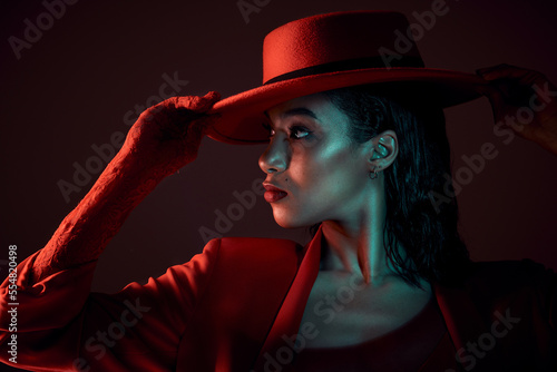 Schilderij op canvas Art, beauty and black woman burlesque dancer on black background with red hat and retro culture at night