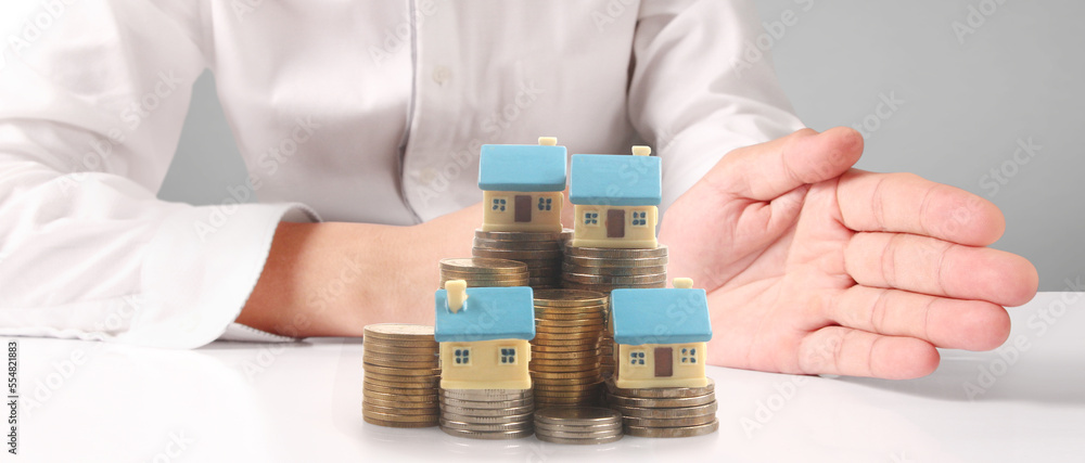 House Residential Structure in hand ,model house and coin House Residential Structure in hand ,model house and coin