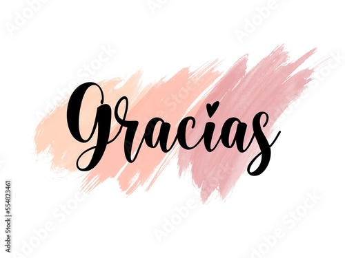 Gracias hand written lettering Thank you in Spanish language on abstract watercolor brushed background