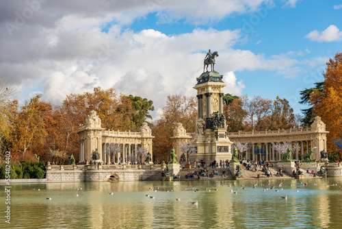 Madrid, monument to Alfonso XII (King of Spain) in Buen Retiro Park (Parque del Buen Retiro) with the small lake and the public park. Community of Madrid, Spain, southern Europe.