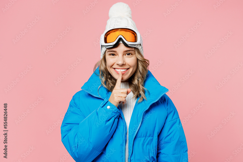 Snowboarder woman in blue suit goggles mask hat ski padded jacket say hush shhh be quiet finger on lips isolated on plain pastel pink background Winter extreme sport hobby weekend trip relax concept Snowboarder woman in blue suit goggles mask hat ski padded jacket say hush shhh be quiet finger on lips isolated on plain pastel pink background Winter extreme sport hobby weekend trip relax concept