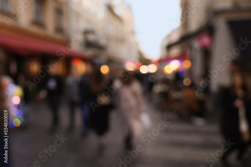 Blurred view of people walking on city street