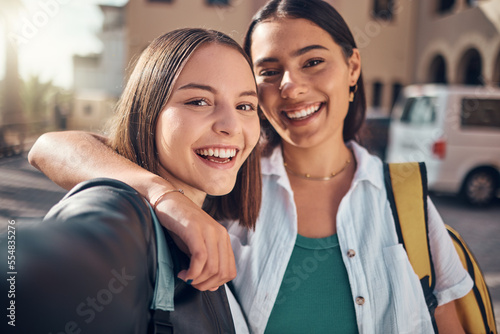 Selfie, smile and students on campus with a hug, excited for school and memory during education. Happy, university and face portrait of girl friends with a photo at college together with happiness