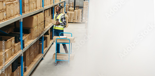 Warehouse picker doing voice-directed order picking photo