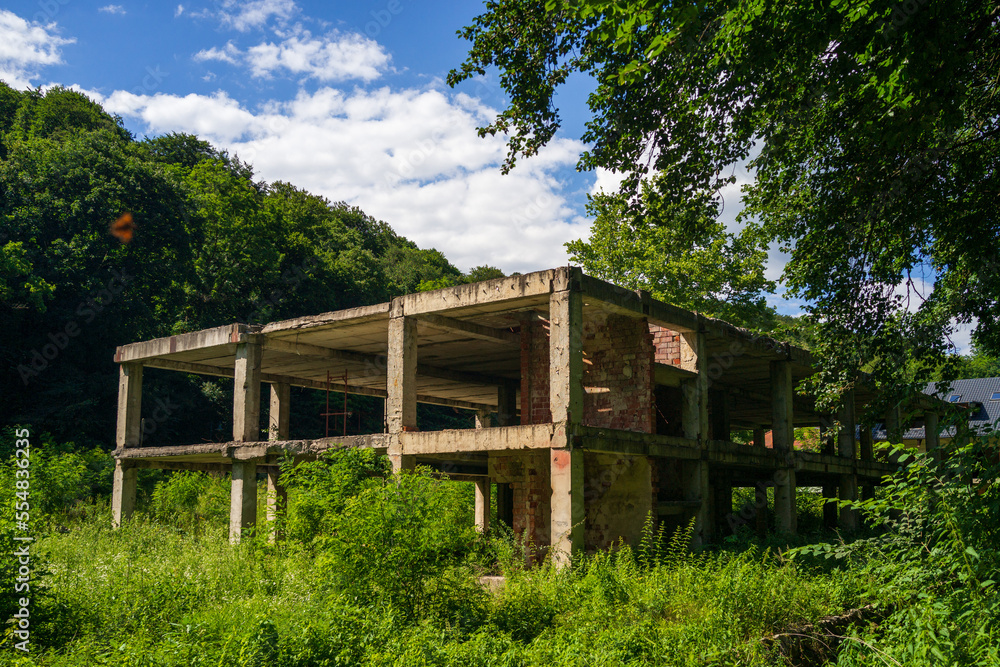old unfinished concrete building in the forest old unfinished concrete building in the forest