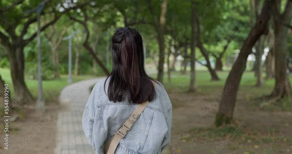Woman walk in the garden park Woman walk in the garden park
