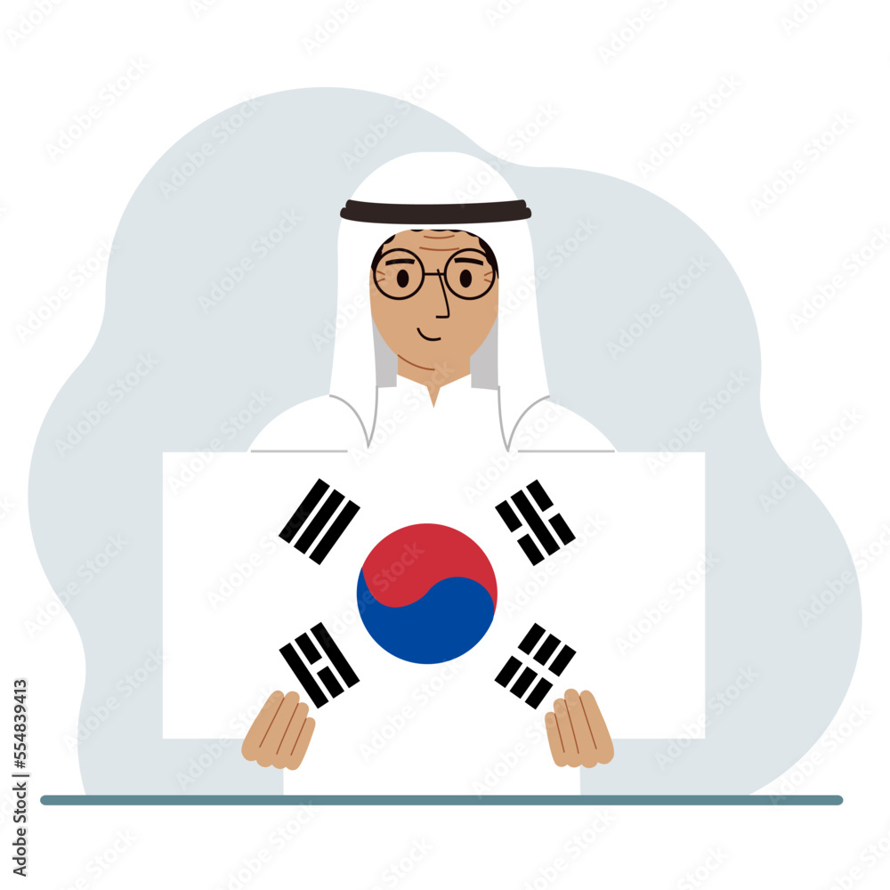 A man is holding the flag of South Korea. The concept of demonstration, national holiday, independence day or patriotism. Nationality. A man is holding the flag of South Korea. The concept of demonstration, national holiday, independence day or patriotism. Nationality.