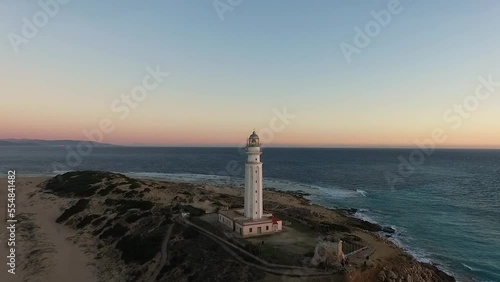 Drone approaching the Trafalgar lighthouse post sunset with the dark blue ocean on coast of Cadiz Spain photo