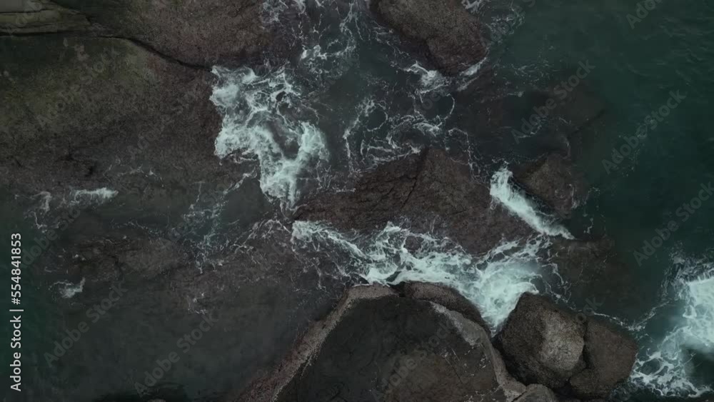 drone flies over sea and rocks,drone aerial top view, fly upward, drone flies over sea and rocks,drone aerial top view, fly upward,