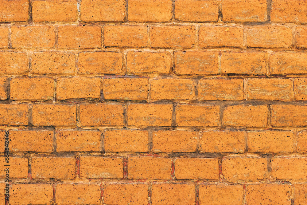 Texture of worn rustic brick wall surface as background Texture of worn rustic brick wall surface as background